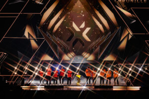 Ethan, mada, s0m, brawk, and skuba of NRG stand next to Chronicle, kaajak, ALfajer, crashies, and Boaster of Fnatic on stage at VALORANT Champions Paris Grand Finals / calendário vct 2026